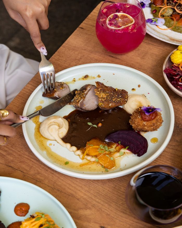 Elegant gourmet dishes and cocktails at a restaurant in Perth, Australia.